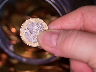 euro coins in hand