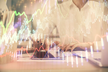 Double exposure of forex chart sketch hologram and woman holding and using a mobile device. Financial market concept.