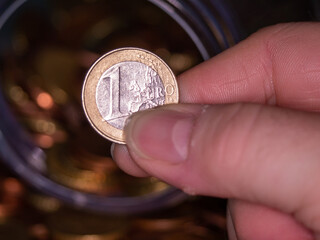 euro coins in hand, donation, saving, charity, family finance plan concept, Coronavirus economic stimulus rescue package, superannuation concept 