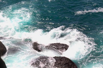 waves crashing on a rock