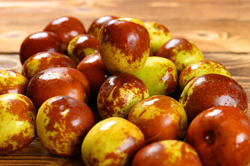 fresh winter jujube on a wood background
