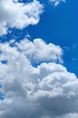 beautiful blue sky with white clouds in the noon time vertical composition