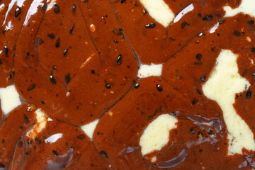 top view melted chocolate blocks with vanilla flavor ice cream close up