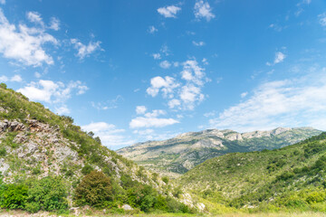 Fototapeta na wymiar Small mountain slope in a sunny summer day
