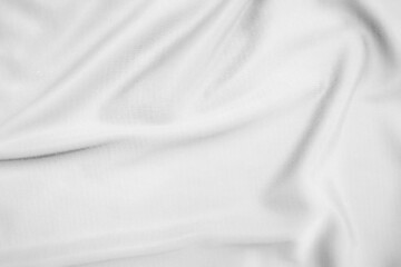 Fototapeta premium Abstract white fabric texture background. Wavy white cloth.