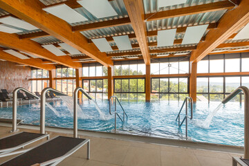 Fototapeta na wymiar Indoor swimming pool in hotel spa and wellness center