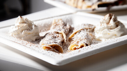 cinnamon crepes on white plate