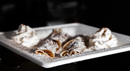 cinnamon crepes on white plate