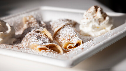 cinnamon crepes on white plate