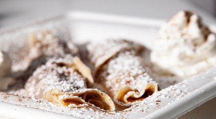 cinnamon crepes on white plate