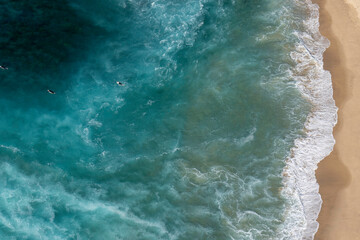 Aerial view of surfers paddling out in a rip at Bronte Beach in Sydney Australia
