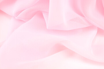 Obraz premium Pink satin fabric with delicate curves