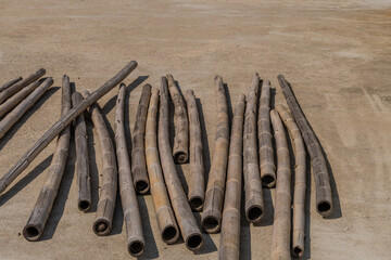 Poles laying on concrete