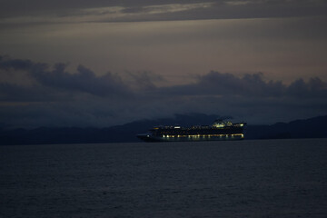 Naklejka na ściany i meble Beautiful aerial view of an empty Gigantic Cruise ship park in Costa Rica due to quarantine