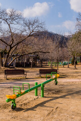 Naklejka premium Seesaw and park benches