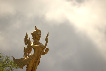 Fototapeta premium Thai statue isolated on a cloudy background