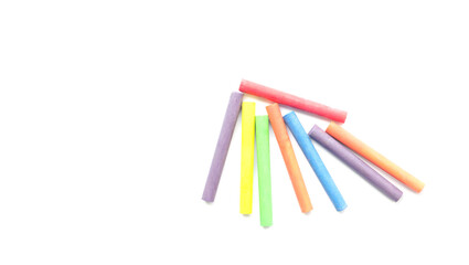 chalks in a variety of colors arranged on a white background