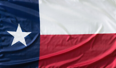 State Flag of Texas on waving silky fabric texture
