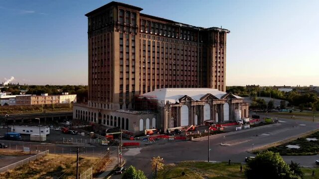 Rising drone footage of Michigan Central Station in Detroit during sunset