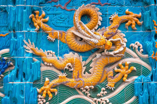 Beijing, China - Jan 11 2020: A Nine-Drgon Screen at Beihai Park, composed of 9 diferent Chinese Dragons found in Chinese imperial palaces and gradens