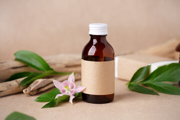 Natural organic cosmetic skincare packaging mock up on craft paper background, monochrome, Eco-friendly bio science beauty concept. Bottle for branding and label, wellbeing self-care focuse