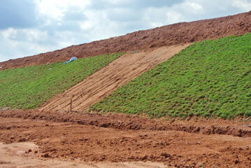 SEREMBAN, MALAYSIA - MARCH 4, 2020: Permanent slope protection using the close turfing method to...