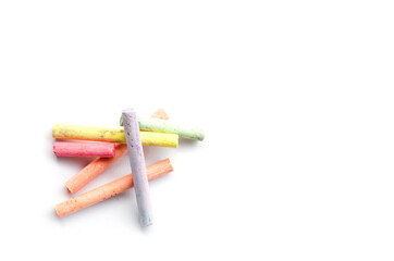 chalks in a variety of colors arranged on a white background