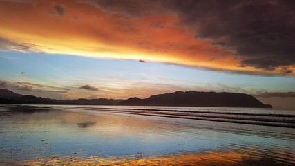 Colors of the sun in a sunrise over the beach