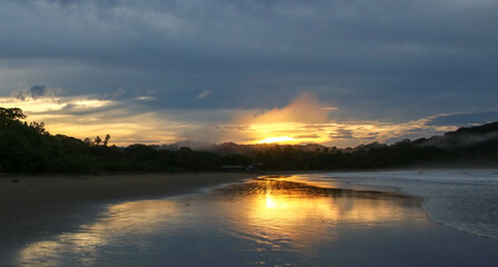 Colors of the sun in a sunrise over the beach