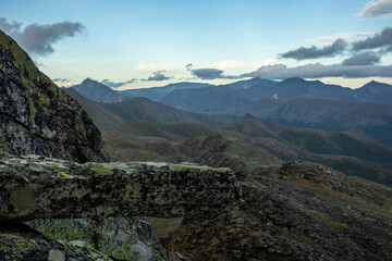 Amazing mountain landscape with colorful sky. Travel and hiking concept. Mountain landscape Subpolar Ural view from Mount Manaraga. Queen of the Ural Mountains.