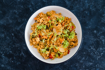 plant-based food, vegan ginger noodles with stir fry vegetables and grated celeri
