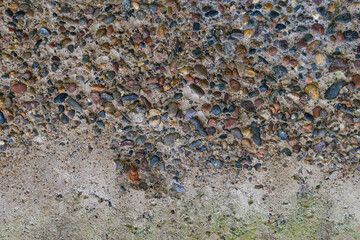 Old concrete wall for the backdrop. Transition from a stony texture to a flat surface.