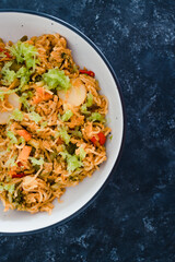 plant-based food, vegan ginger noodles with stir fry vegetables and grated celeri