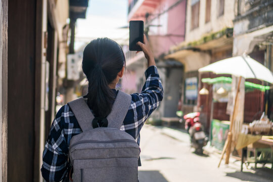 Woman travel around the world with backpack freedom concept.