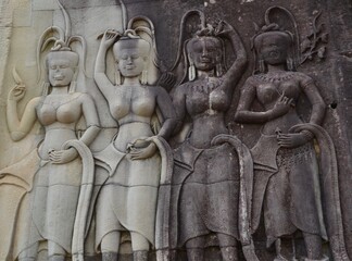 Detail of four stone goddesses at a temple in Siem Reap, Cambodia