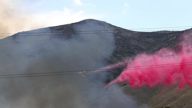 Small Plane Dropping Red Fire Retardant