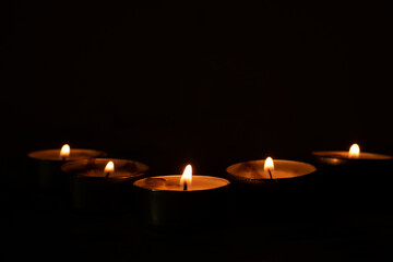 candles that are lit in the dark