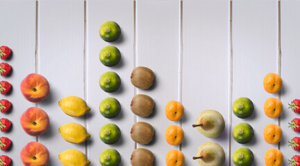 Sound of Fruits. Colorful Fresh Fruits Pattern. Fresh Fruits on Wooden Table. Apple, Pear, Kiwi,...