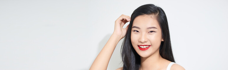 Beautiful young Asian woman on white background