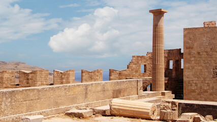 Fototapeta premium Acropolis of Lindos, the ruins of an ancient temple and the remains of the Doric columns. Lindos, Rhodes, Greece 