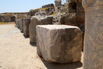 Stone bases of statues, the Acropolis of Lindos, Greece. The dedications in Greek glorify the gods