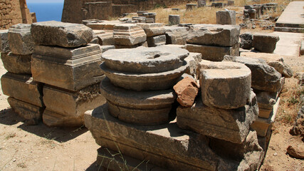 Stone bases of statues, the Acropolis of Lindos, Greece. The dedications in Greek glorify the gods