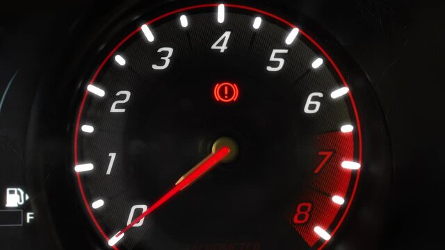 Car tachometer engine revving needle indicates redline speed vibration with subtle flares in 4K