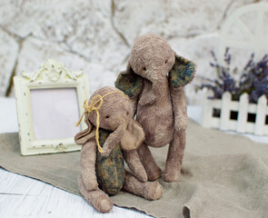 two toy elephants handmade in vintage style.For postcards, posters for christmas day, holiday.Selective focus.