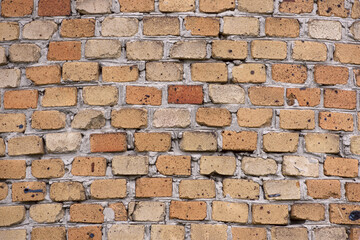 Background. A fragment of a laying of coloured bricks closeup.