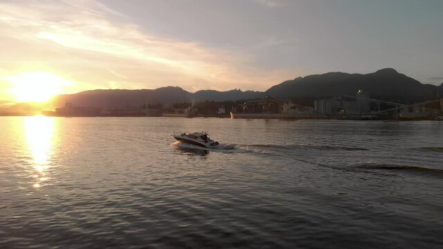 A small pleasure craft in Vancouver harbor at sunset. 24FPS 4K.