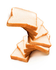 milk bread on white background, homemade slide bread on the wooden broad, Sliced bread isolated on a white background. Bread slices and crumbs viewed from above. Top view