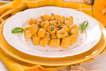Pumpkin gnocchi with grated amaretti cookies.	