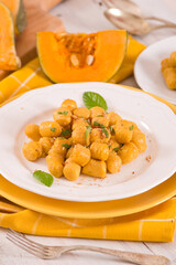 Pumpkin gnocchi with grated amaretti cookies.	