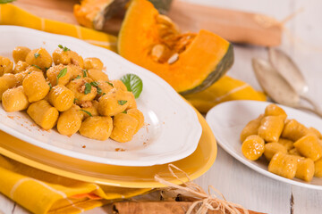 Pumpkin gnocchi with grated amaretti cookies.	